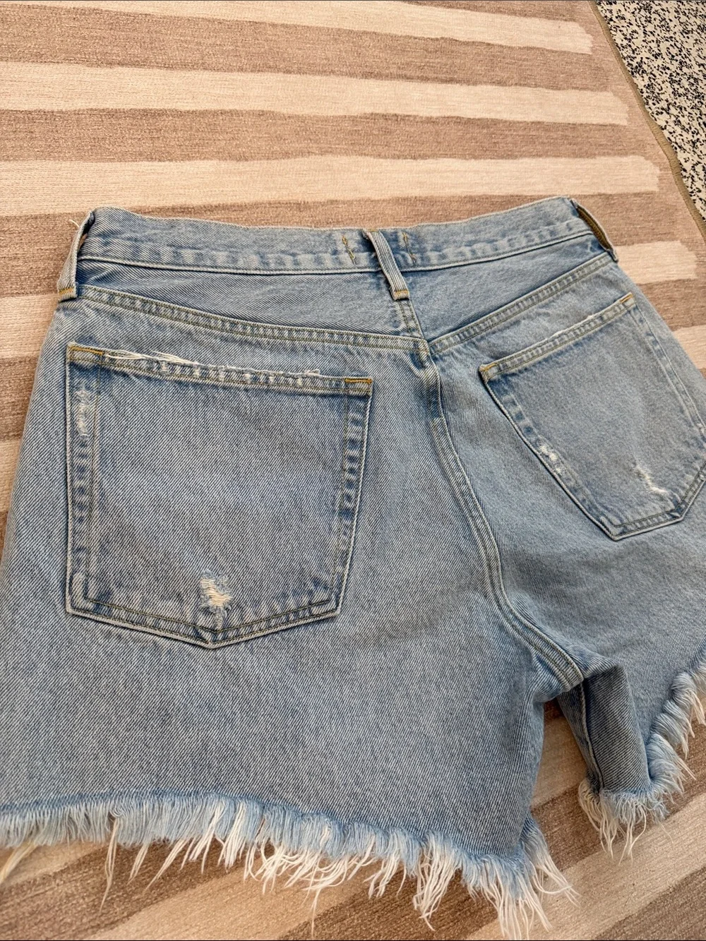AGOLDE Medium Wash Frayed Hem Denim Cutoff Shorts